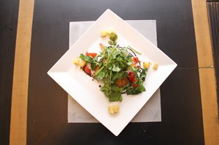 Breaded & pounded chicken breast Milanese style with arugula, cherry tomato salad